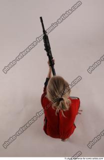 DENISA KNEELING POSE WITH GUN